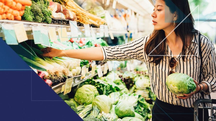 Woman grocery shopping in the produce section