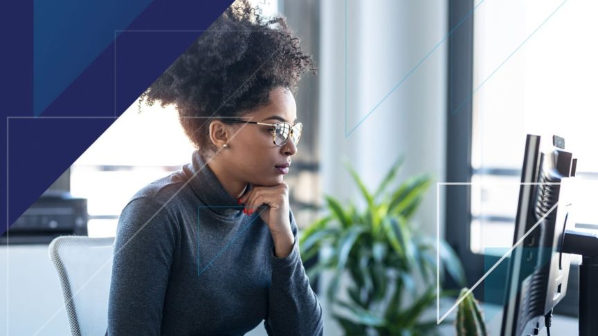 Woman reading her computer screen at work