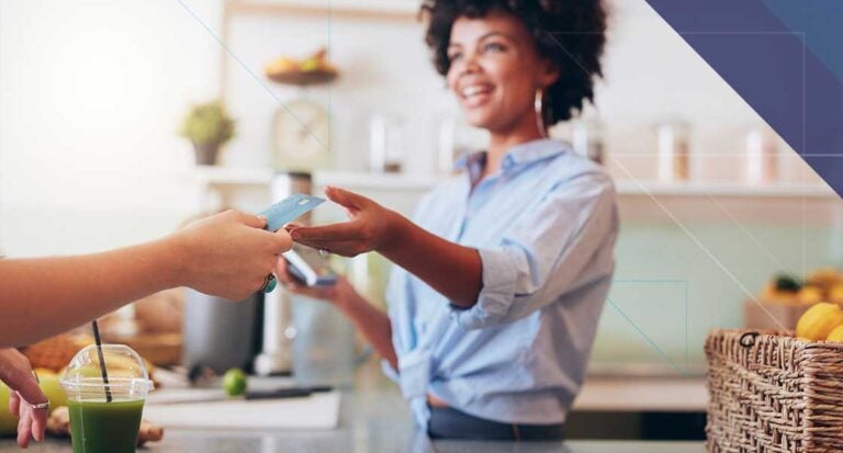 Bluefin and 934 Advance Secure Hospitality Payments with Juno Hospitality employee accepting a customer payment representing secure connected payments through Bluefin and 934 Juno