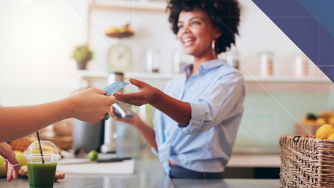 Bluefin and 934 Advance Secure Hospitality Payments with Juno Hospitality employee accepting a customer payment representing secure connected payments through Bluefin and 934 Juno